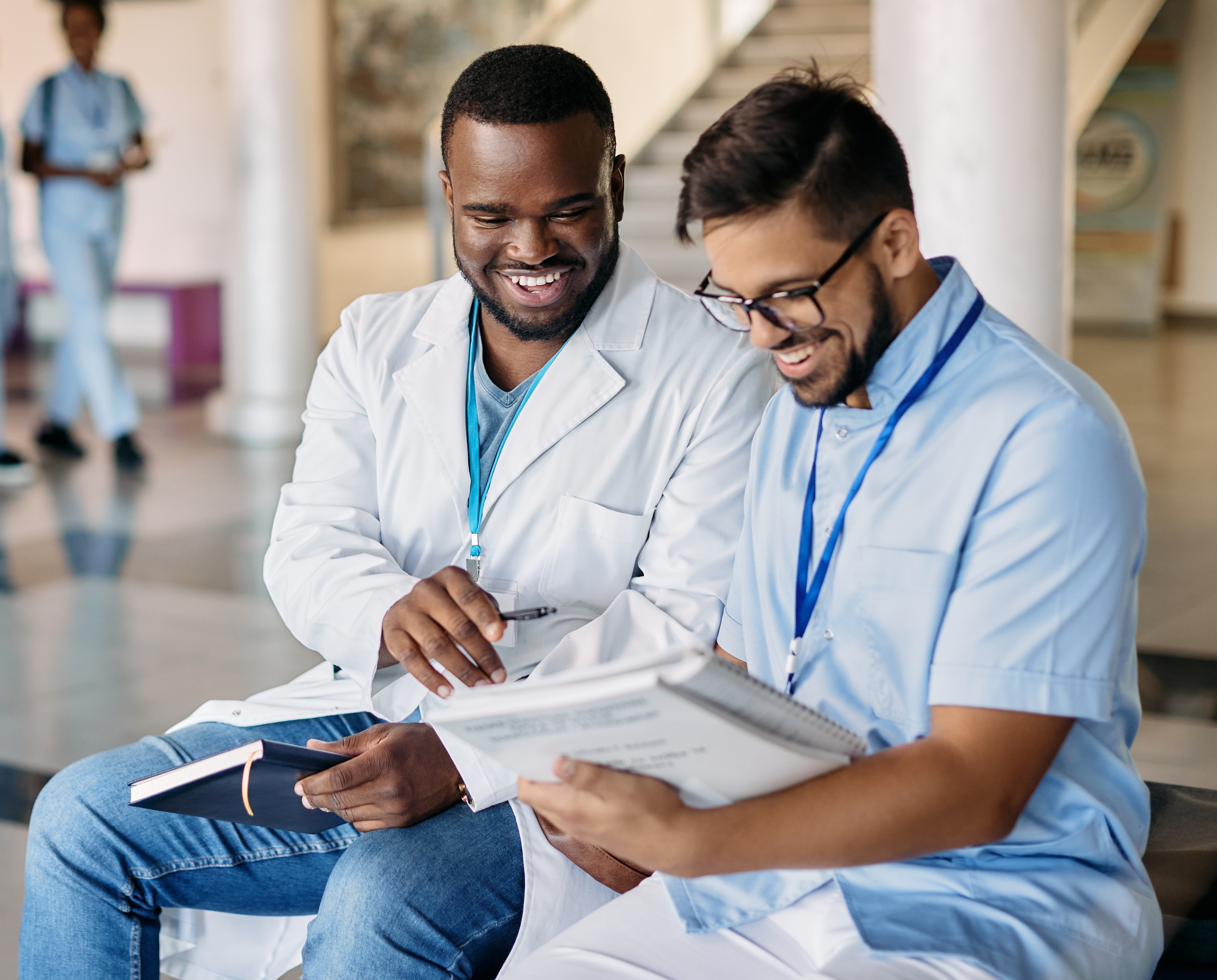 Photo of two male doctors studying 